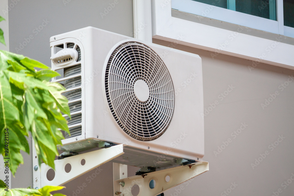 Air conditioner compressor outdoor unit installed outside the house ...