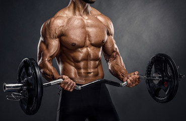  Muscular Men Lifting Weights. Studio Shot