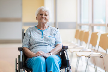 Wall Mural - Portrait of an elderly woman sitting in her wheelchair