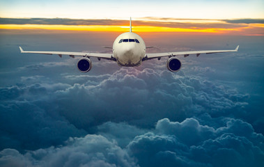 white, passenger airliner fly in sky