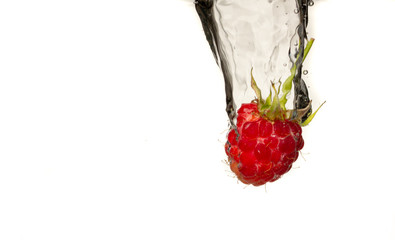 Poster - Close-up photo, on a very short exposure, strawberries falling into the water on a white background close up