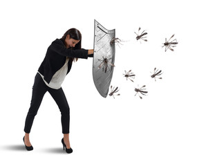 Woman defends herself from the attack of mosquitoes with a shield