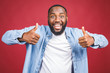 © denis_vermenko - Portrait of happy african american man isolated over red background. Thumbs up.