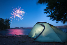A Tent Glows My Lamp Light As Nearby Campers Set Of Fireworks In Celebration Of The Fourth Of July At Banks Lake In Central Washington.