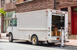 © Rawf8 - White color truck delivering packages, Manhattan downtown