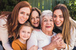 © Cavan Images - Portrait of multigenerational women close together