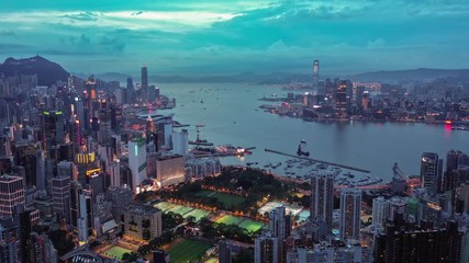 Wall Mural - 4k aerial hyperlapse video of Victoria Harbour in Hong Kong at sunset