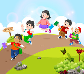 Wall Mural - the children are walking on the road go to school 