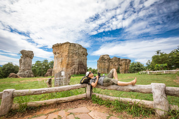 Photographapher woman on Stonehenge of Thailand, Mo Hin Khao in Phu Lan Kha National Park, Chaiyaphum province, Thailand.