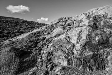 Rocky landscape with two clouds in black & white