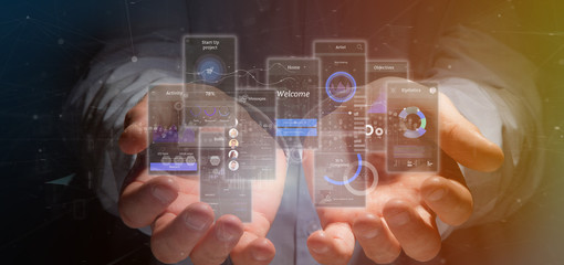 Poster - Businessman holding User interface screens with icon, stats and data 3d rendering
