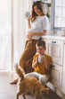 © Alena Ozerova - Pregnant mom with kid drinking tea together in the kitchen
