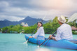 © Panumas - Cheerful happiness couple kayaking in the Lagoon on summer vacation