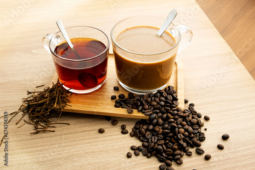 Fototapeta na drzwi i meble Hot tea and coffee With tea leaves and coffee beans