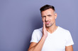 © deagreez - Close up photo amazing he him his middle age macho hand arm hold cheekbone teeth terrible pain injury sadness cry facial expression weakness wear casual white t-shirt isolated grey background