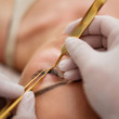 © Nejron Photo - Procedure of eyelash extension in salon by cosmetician
