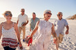 © Monkey Business - Group Of Senior Friends Walking Along Sandy Beach On Summer Group Vacation