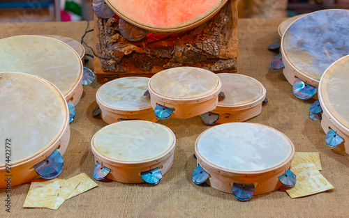 Fotografía Typical small handmade Salento tambourines for sale on a stall during a festival