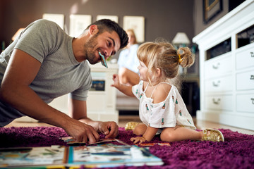 Wall Mural - Child with father having fun at home