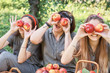 © Serenkonata - Girls with Apple in the Apple Orchard. Beautiful sisters with Organic Apple in the Orchard. Harvest Concept. Garden, teenagers eating fruits at fall harvest.