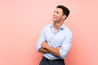 © luismolinero - Handsome man over pink background happy and smiling