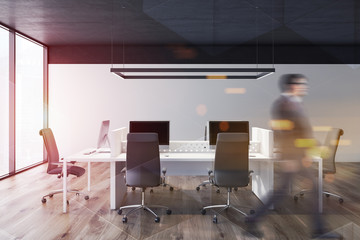 Canvas Print - Man walking in white open space office