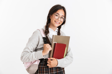 Sticker - Photo closeup of happy teenage girl wearing eyeglasses stressing and grabbing her head while holding studying books