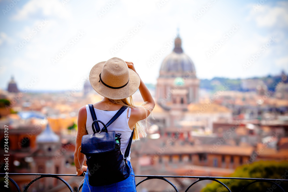 Rome Europe Italia travel summer tourism holiday vacation background -young smiling girl with mobile phone camera and map in hand standing on the hill looking on the cathedral Vatican - obrazy, fototapety, plakaty 