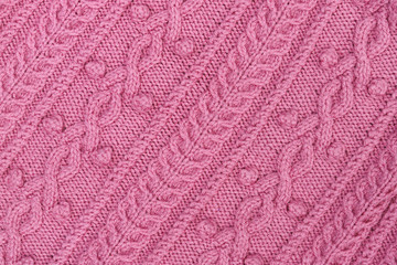 Abstract textured background of close up detail of knitting in a handmade sweater