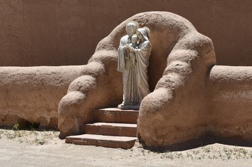 Straw adobe niche with a traditional style statue of the Holy Family, Los Ranchos de Taos, New Mexico