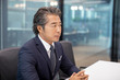 © Blue Jean Images - Successful businessman in meeting room