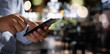 © onephoto - man holding en hands and using digital tablet  Mobile Phone telephone with blank copy space scree