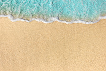 Soft Waves With Foam Of Ocean On The Sandy Beach Background