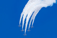 Aerobatics Loop Flying By Five Colleague Jets In Blue Sky