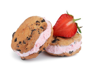 Sweet delicious ice cream cookie sandwiches and strawberry on white background