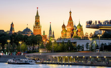 Moscow Kremlin And St Basil`s Cathedral At Sunset, Russia. Zaryadye Park On Embankment Of Moskva River. Beautiful Panorama Of The Moscow City Center At Night.