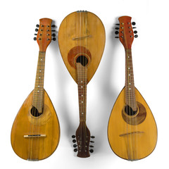 Wall Mural - Three vintage mandolins. Isolated on a white background. In the square.