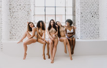 Group Of Women With Different Body And Ethnicity Posing Together To Show The Woman Power And Strength. Curvy And Skinny Kind Of Female Body Concept
