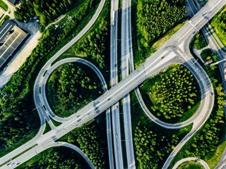 Wall Mural - Aerial view of highway and overpass with green woods in Finland.