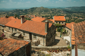 Wall Mural - Old stone houses with alley making a curve in Monsanto