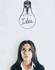 Poster - Attractive businesswoman with lightbulb