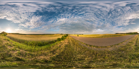 Wall Mural - spherical hdri panorama 360 degrees angle view near asphalt road among fields in summer evening sunset with cirrocumulus clouds in equirectangular projection, ready VR AR virtual reality content