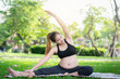 © kriangphoto31 - Pregnant woman doing yoga exercise in park nature, Portrait of beautiful young pregnant woman sitting near an exercise. yoga and fitness, Health pregnancy concept.