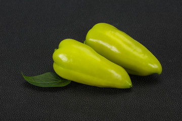 Green bell pepper over wooden background