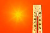 Fototapeta Natura - Summer heat. Thermometer shows high temperature in summer. Ambient temperature plus 42 degrees celsius