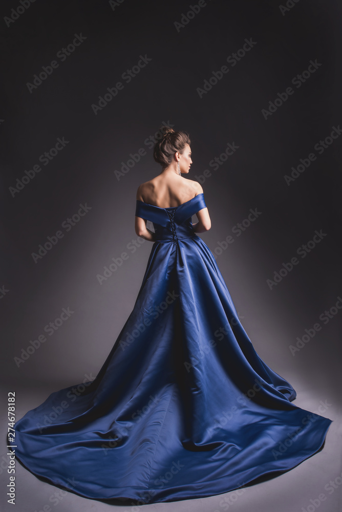 background for blue dress Blonde Woman in Elegant Blue Gown, Back View, Flowing Fabric, Artistic Style, White Background Stock Illustration