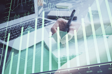 Forex chart displayed on woman's hand taking notes background. Concept of research. Double exposure