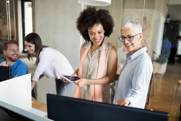 Sticker - Young african american woman working with tablet in office