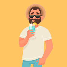 Concept Of Relaxation And Summer Vacation. A Man In Sunglasses Is Drinking A Cocktail. Rest By The Sea