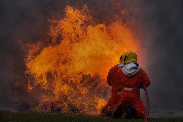 Firefighter are using water in fire fighting operation